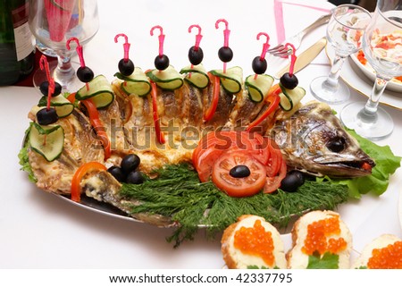 Roast fish with vegetables and greens