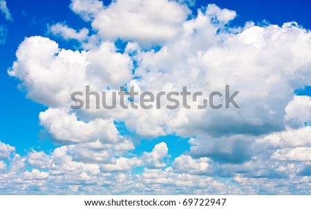 Background of blue sky with cumulus clouds in fine summer day