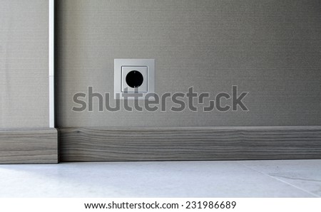 Electricity power socket (European standard) on wall background