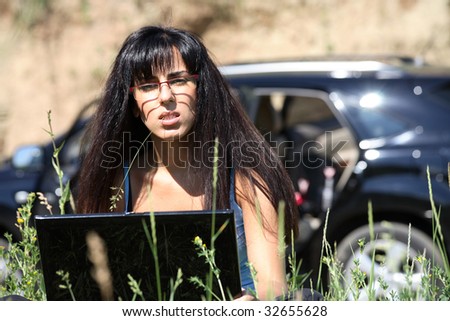 business woman with laptop on the nature