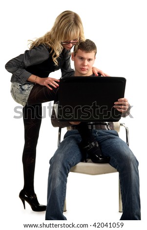 sexual woman standing one foot on a chair before young manager, other foot on the floor
