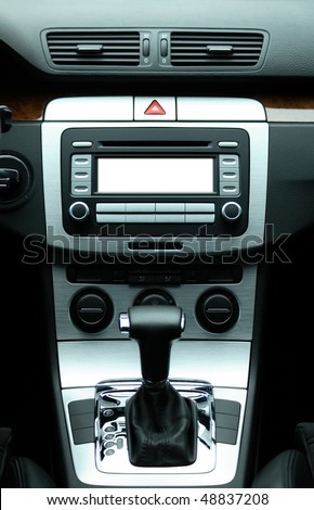 Modern luxury car interior with white space for text on center audio system