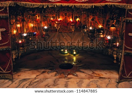 BETHLEHEM - OCTOBER 05: A silver star marks the traditional site of the birth of Jesus in a grotto underneath Bethlehem\'s Church of the Nativity, Bethlehem, Israel on October 05, 2006.