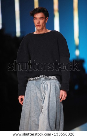ZAGREB, CROATIA - MARCH 15: Fashion model wears clothes made by Young and Sqaut on 