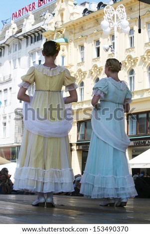ZAGREB,CROATIA - JULY 18: Members of the ensemble song and dance Warsaw School of Economics in in old style costumes during the 47th International Folklore Festival in Zagreb,Croatia on July 18,2013