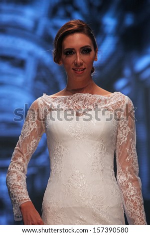 ZAGREB, CROATIA - OCTOBER 04: Fashion model wears dress made by Royal Bride on \'Wedding days\' show, October 04, 2013 in Zagreb, Croatia.