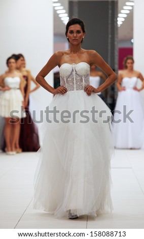 ZAGREB, CROATIA - OCTOBER 12: Fashion model in wedding dress made by Ana Milani on \'Wedding Expo\' show in the Westgate Shopping City in Zagreb, Croatia on October 12, 2013
