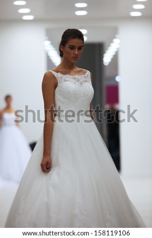 ZAGREB, CROATIA - OCTOBER 12: Fashion model in wedding dress made by Lisa and Maggie Sottero on \'Wedding Expo\' show in the Westgate Shopping City in Zagreb, Croatia on October 12, 2013