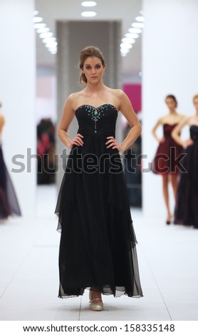 ZAGREB, CROATIA - OCTOBER 12: Fashion model in cocktail dress made by Ana Milani on \'Wedding Expo\' show in the Westgate Shopping City in Zagreb, Croatia on October 12, 2013