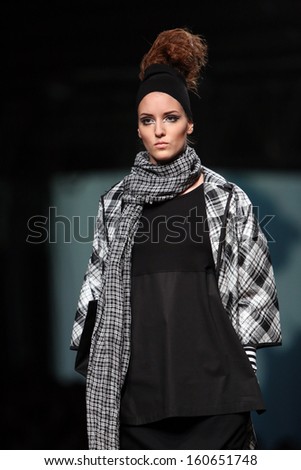 ZAGREB, CROATIA - OCTOBER 25: Fashion model wearing clothes designed by XD Xenia Design on the Cro a Porter show on October 25, 2013 in Zagreb, Croatia.