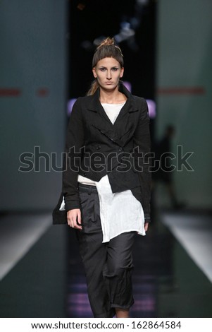 ZAGREB, CROATIA - OCTOBER 17: Fashion model wearing clothes designed by Link on the \'Fashion.hr\' show on October 17, 2013 in Zagreb, Croatia.