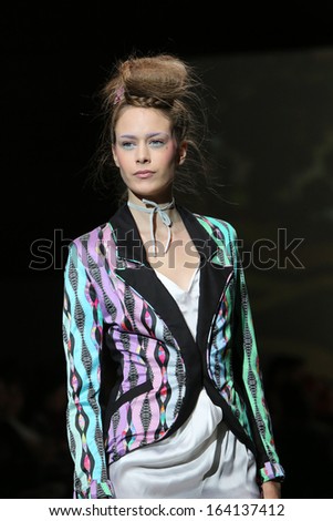 ZAGREB, CROATIA - NOVEMBER 22: Fashion model wearing clothes designed by Tramp in Disguise on the Zagreb Fashion Week show on November 22, 2013 in Zagreb, Croatia.