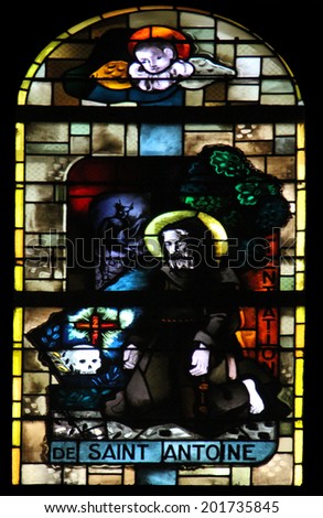 PARIS, FRANCE - NOV 05,2012:Saint Anthony the Great stained glass in Church of St Eustace. Church was built in 1532-1632 and considered a masterpiece of late Gothic architecture,Paris on Nov 05,2012.