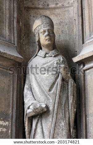 PARIS, FRANCE - NOV 11, 2012: Statue of Saint, Church of St-Germain-l\'Auxerrois founded in the 7th century, was rebuilt many times over several centuries.