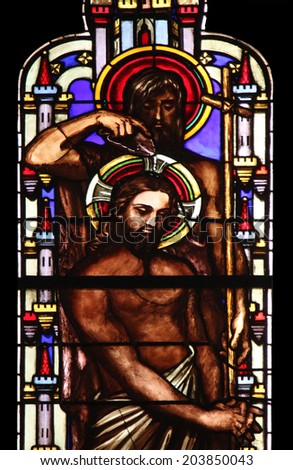 PARIS, FRANCE - NOV 11, 2012: Baptism of the Lord, stained glass from Church of St-Germain-l\'Auxerr ois founded in the 7th century, was rebuilt many times over several centuries.