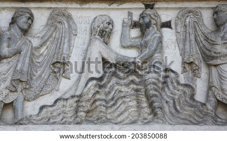 PARMA, ITALY - MAY 01, 2014: Baptism of Jesus Christ on the baptistery from Benedetto Antelami. Baptistery in Parma is considered to be among the most important Medieval monuments in Europe.