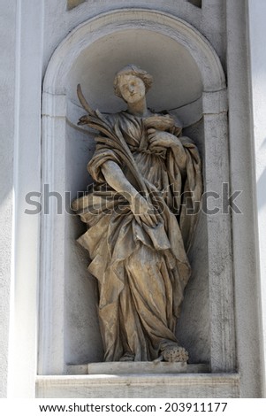 PARMA, ITALY - MAY 01, 2014: Saint Lucia statue, St Lucia church. Church, originally known as St. Michael in the Channel is mentioned in documents in 1223, built in 1615 and dedicated to St. Lucia