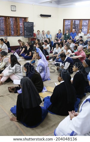 KOLKATA, INDIA - FEBRUARY 15: Sisters of Mother Teresa\'s Missionaries of Charity and volunteers from around the world at the Mass in the chapel of the Mother House, Kolkata, India at February 15,2014.