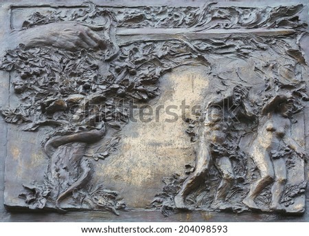 PORT AZZURRO, ITALY - MAY 03,2014: Adam and Eve, the expulsion from paradise, detail on the door of the church of St. James the Greater. The church is located inside the fort of the same name.