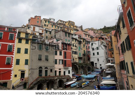 LIGURIA, ITALY - MAY 02, 2014: Riomaggiore, one of the Cinque Terre villages, UNESCO World Heritage Sites, remains a magnet for tourists to the famous Via dell\'Amore remains closed, Riomaggiore, Italy