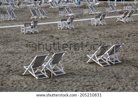 VIAREGGIO, ITALY - MAY 01: Typical Italian beach chairs in Viareggio, one of the most well known summer Italian vacation spots, on May 01,2014, Viareggio, Italy