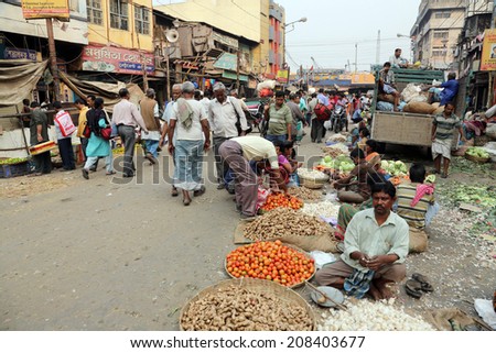 KOLKATA, INDIA - FEBRUARY 11: Street trader sell vegetables outdoor on February 11, 2014 in Kolkata India. Only 0.81% of the Kolkata\'s workforce employed in the primary sector (agriculture)