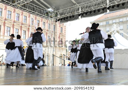 ZAGREB, CROATIA - JULY 20: Members of folk groups St. Jerome from Mala Strigova, Croatia during the 48th International Folklore Festival in center of Zagreb, Croatia on July 20, 2014
