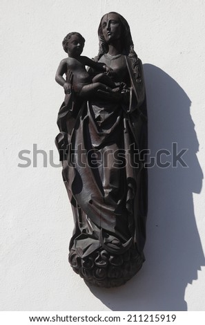 MILTENBERG, GERMANY - 20 JULY: Madonna with child Jesus, statue on the main street of Miltenberg in Lower Franconia, Bavaria, Germany, on July 20, 2013