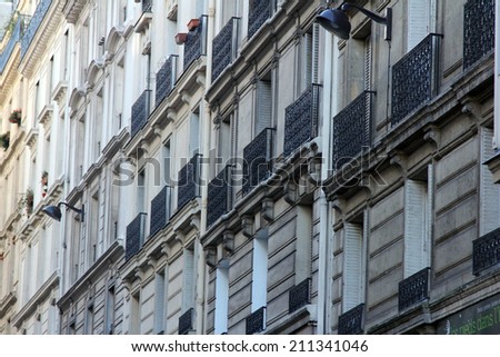 PARIS, FRANCE - NOVEMBER 04, 2012: Facade of a traditional apartment building in Paris, France on November 04, 2012