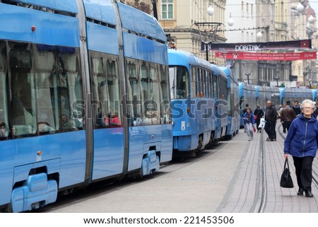ZAGREB, CROATIA - OCTOBER 04: Blue city trams stay in a traffic jam in the city center in Zagreb, on October 04, 2014