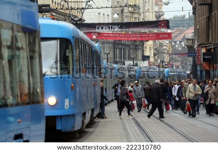 ZAGREB, CROATIA - OCTOBER 04: Blue city trams stay in a traffic jam in the city center in Zagreb, on October 04, 2014
