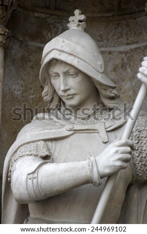 ZAGREB, CROATIA - SEP 25: statue of Saint George on the portal of the cathedral dedicated to the Assumption of Mary and to kings Saint Stephen and Saint Ladislaus in Zagreb on Sep 25, 2013.