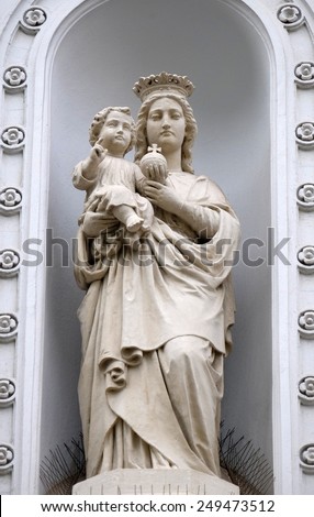 GRAZ, AUSTRIA - JANUARY 10, 2015: Virgin Mary with baby Jesus, statue on the house facade in Graz, Styria, Austria on January 10, 2015.