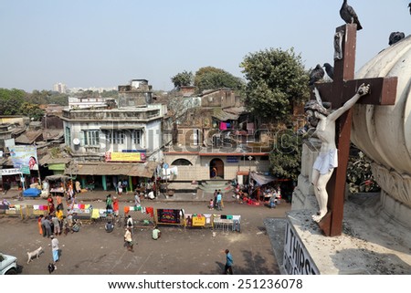 KOLKATA, INDIA - FEBRUARY 10, 2014: Crucifix on top of the Nirmal Hriday, Home for the Sick and Dying Destitutes established by the Mother Teresa and run by Missionaries of Charity in Kolkata, India