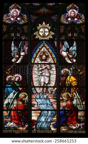 VIENNA, AUSTRIA - OCTOBER 11: Baptism of the Christ, Stained glass in Votiv Kirche (The Votive Church). It is a neo-Gothic church in Vienna, Austria on October 11, 2014
