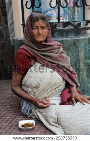 KOLKATA, INDIA - FEBRUARY 10, 2014: Beggars in front of Nirmal, Hriday, Home for the Sick and Dying Destitutes established by the Mother Teresa and run by the Missionaries of Charity in Kolkata, India
