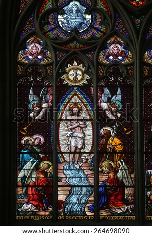 VIENNA, AUSTRIA - OCTOBER 10: Baptism of the Christ, Stained glass in Votiv Kirche (The Votive Church). It is a neo-Gothic church located on the Ringstrabe in Vienna, Austria on October 10, 2014
