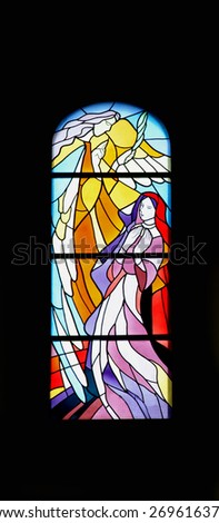 MEDUGORJE, BOSNIA AND HERZEGOVINA - FEBRUARY 19: The Annunciation, stained glass church window in the parish church of St. James in Medugorje on February 19, 2011.