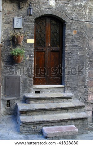 Wooden door with a stone door frame