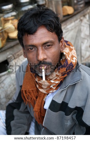 KOLKATA, INDIA - JANUARY 14: Portrait of a day laborer January 14, 2009 in Kolkata, India. These men sit on the street hoping to get day jobs not paid more than 2,5 dollars a day.