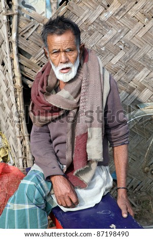 BASANTI, INDIA- JANUARY 14: Portrait of a day laborer January 14, 2009 in Basanti, West Bengal, India. These men sit on the street hoping to get day jobs not paid more than 2,5 dollars a day.