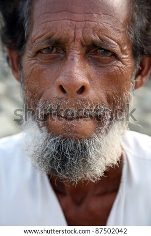 KUMROKHALI, INDIA - JANUARY 16: Portrait of an unidentified day laborer January 16, 2009 in Kumrokhali, West Bengal, India. These men sit on the street hoping to get day jobs not paid more than 2,5 dollars a day.