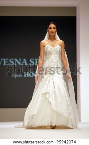 ZAGREB, CROATIA - FEBRUARY 19: Fashion model wears wedding dress made by Vesna Sposa on \'Wedding days\' show, February 19, 2012 in Zagreb, Croatia.