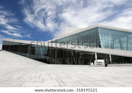 OSLO, NORWAY - SEPTEMBER 19: Oslo Opera House facade on September 19, 2015 in Oslo, Norway. The angled surfaces are covered with Italian marble and white granite and make it appear to rise from water.
