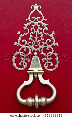 Bronze knocker on the door of a building in Bordeaux, France
