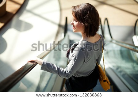 Smiling girl in  a shopping center