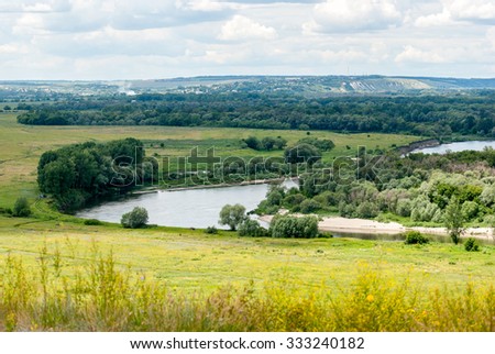 River Don in Voronezh region. Rural landscape. Meadows and fields, the village in the distance.