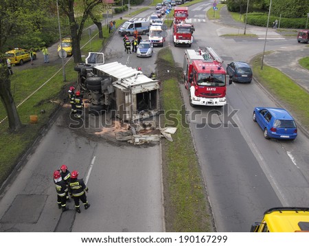 CZESTOCHOWA; POLAND - APRIL 30: Road accident in Czestochowa. Traffic accident April 30, 2014 in Czestochowa, Poland. Car for the dumping of garbage lying on the road.