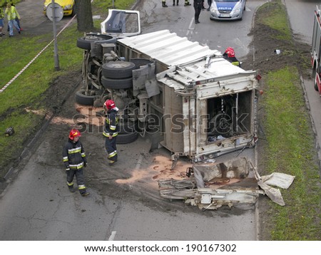 CZESTOCHOWA; POLAND - APRIL 30: Road accident in Czestochowa. Traffic accident April 30, 2014 in Czestochowa, Poland. Car for the dumping of garbage lying on the road.