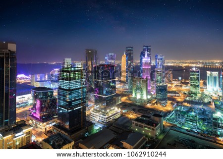 View to the city center of Doha, Westbay, Qatar, by night with starry sky